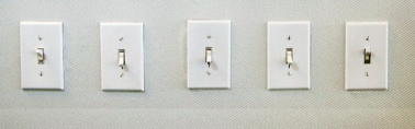 A row of five light switches